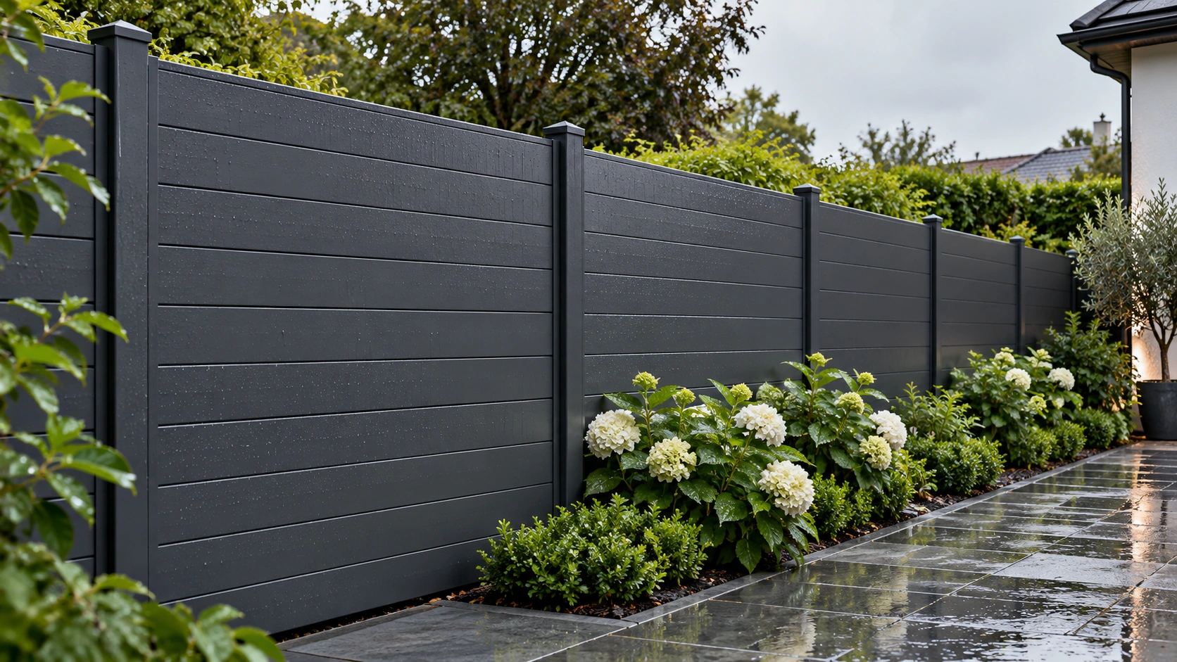 Charcoal privacy fencing along a garden path